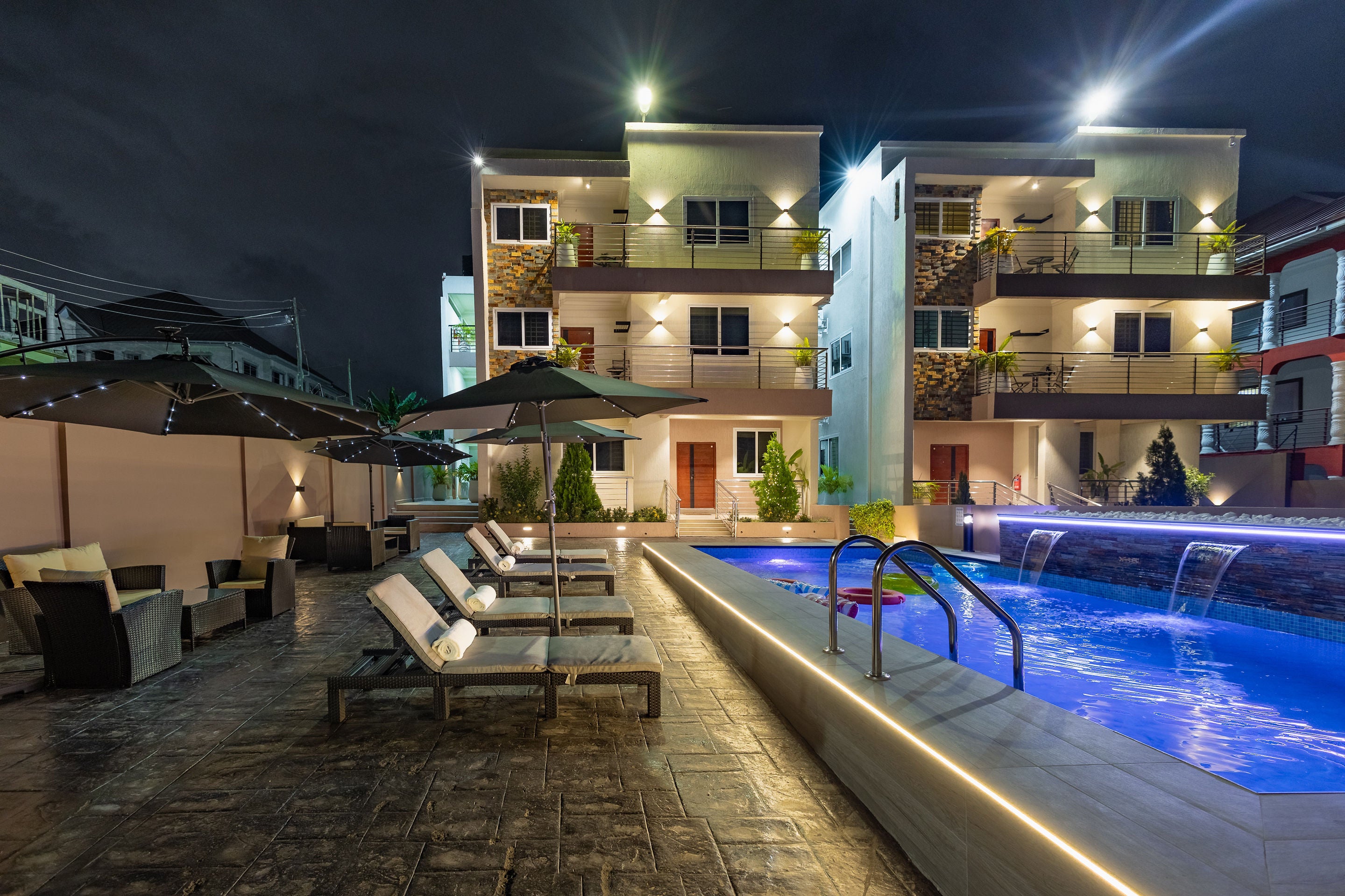 Pool deck seating beside the apartments